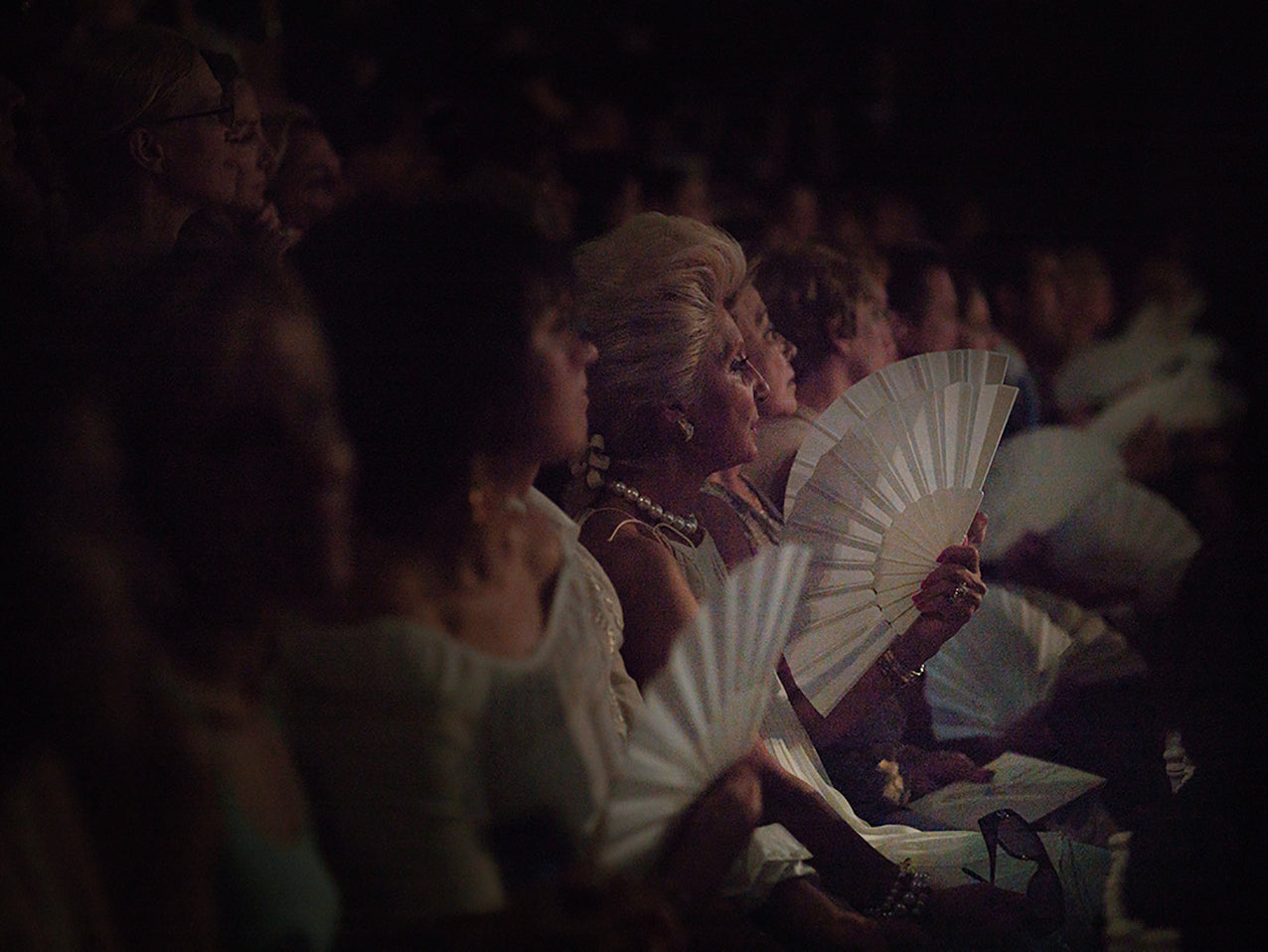 The Audience V2 (2006) by artist, depicting the Christian Lacroix haute couture runway show in Paris. The photograph captures spectators in a theatrical scene evoking ancient Egyptian or Roman drama, highlighting themes of vanity, status, and the relentless pursuit of perfection in fashion.