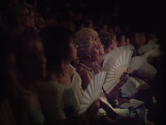 The Audience V2 (2006) by artist, depicting the Christian Lacroix haute couture runway show in Paris. The photograph captures spectators in a theatrical scene evoking ancient Egyptian or Roman drama, highlighting themes of vanity, status, and the relentless pursuit of perfection in fashion.